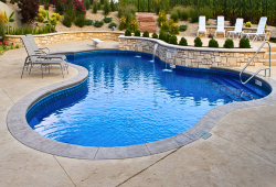 Lagoon with vinyl step entry, shallow bench, and sheer descent water feature on the retaining wall for a second level seating area